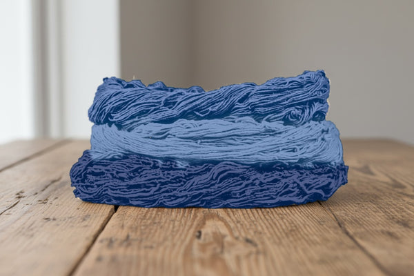Skeins of cotton plant-dyed with natural indigo in shades of blue