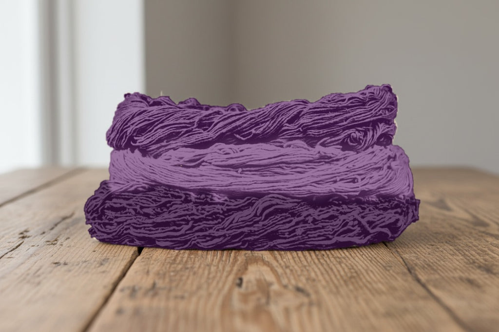 Skeins of cotton plant-dyed with sappanwood and dark siyahi in shades of plum purple