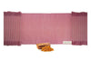 Sappanwood rose-red yoga mat laid flat with sappanwood chips and shavings in front