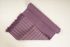 Dusky purple Sappanwood with Dark Siyahi yoga mat, folded back to show both sides and fringe