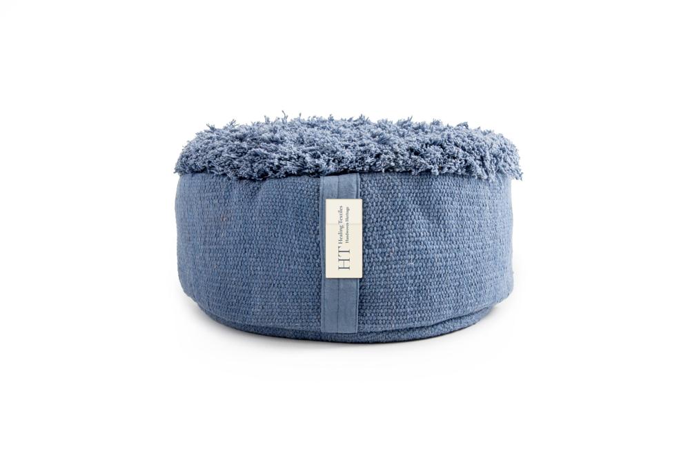 Round indigo blue meditation cushion with a soft, shaggy woven top