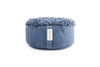 Round indigo blue meditation cushion with a soft, shaggy woven top