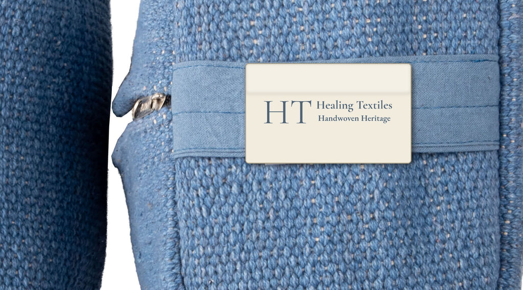 Close-up of an indigo yoga block showing the woven cotton texture, zip and Healing Textiles label
