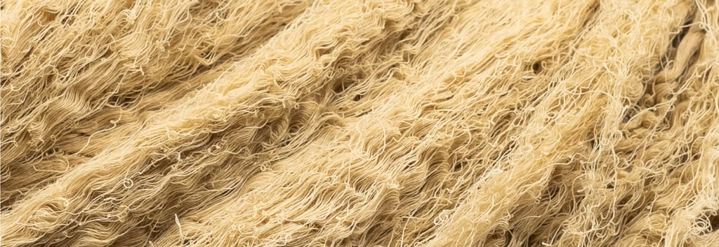 Close-up of pale straw-coloured cotton threads
