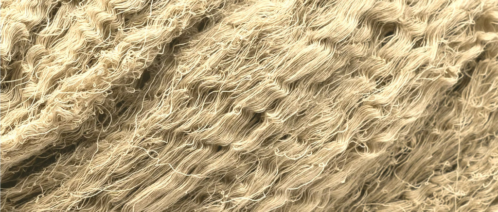 Close-up of stone-clay cotton threads dyed with harda