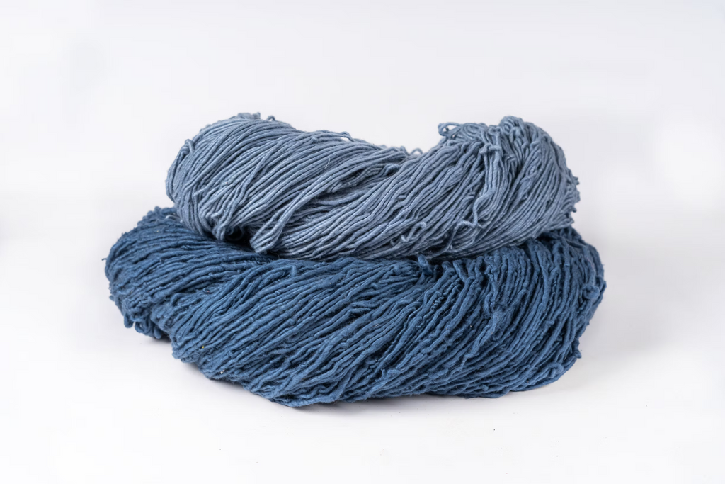Raw Indigo-dyed organic cotton fabric showing the natural plant dye colour and texture